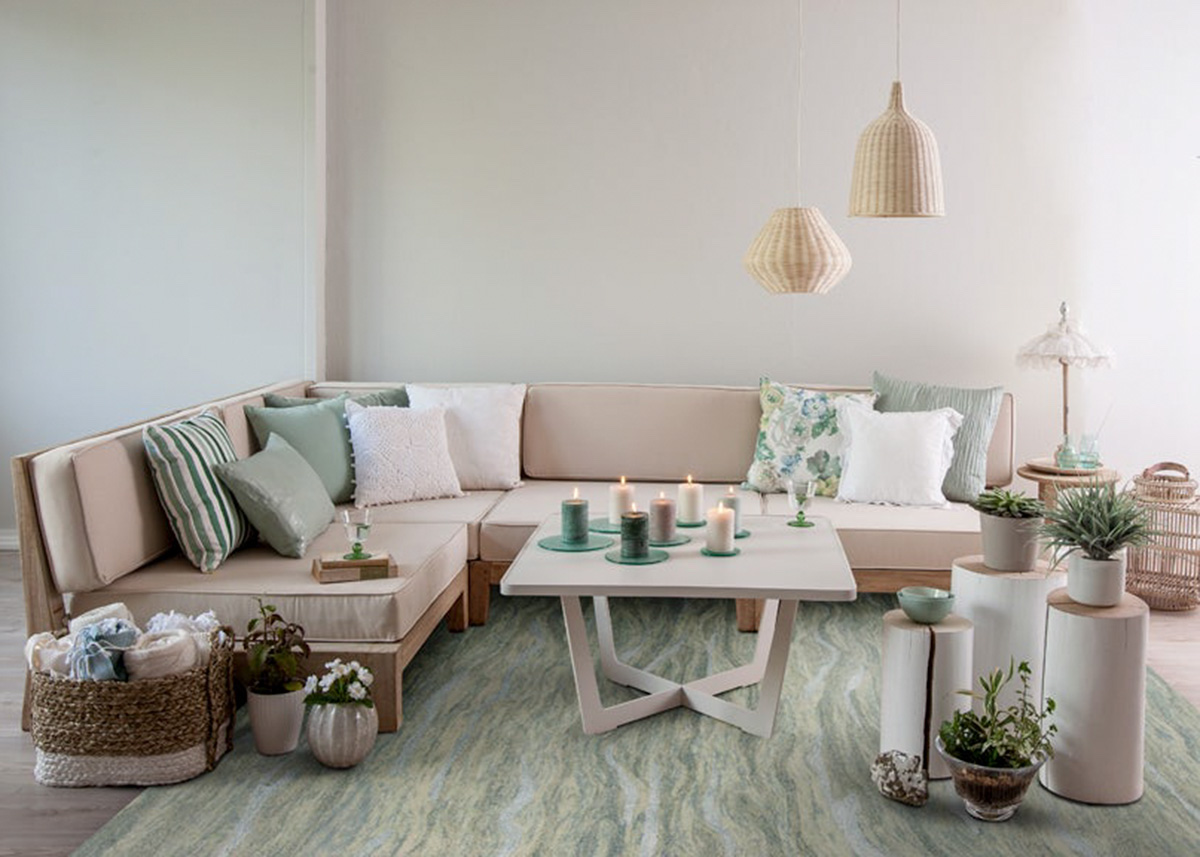 modern room with many plants and candles over a green rug