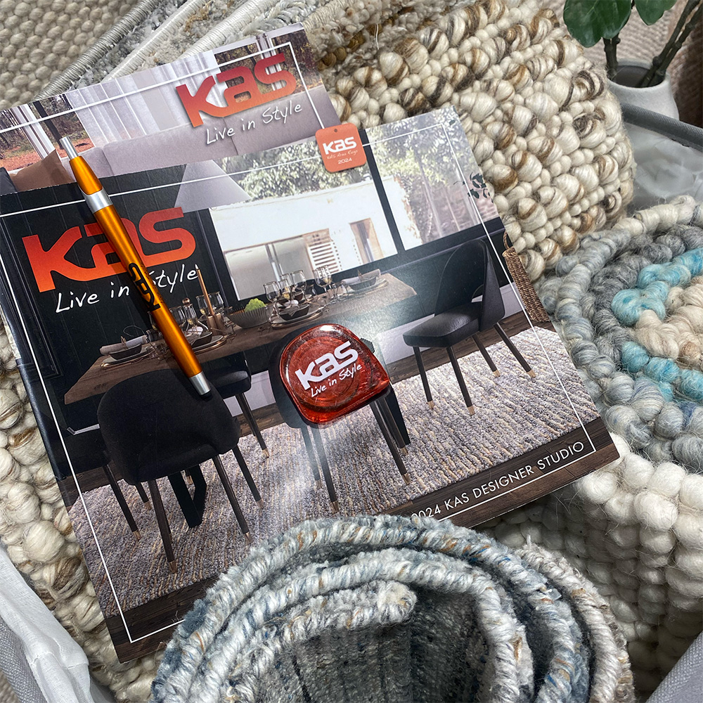 many rug swatches with a swatch catalog on top